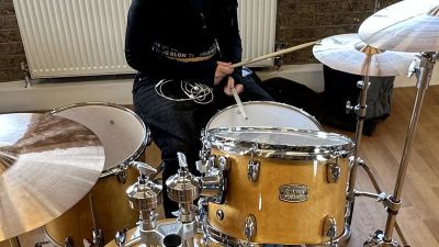 A Music Makers student is playing using a Yamaha drumkit.
